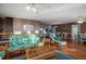 Open living space with wicker furniture, hardwood floors and view into dining area at 403 W West Ashley Ave, Folly Beach, SC 29439