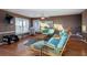 Relaxing living room with wicker furniture and hardwood floors at 403 W West Ashley Ave, Folly Beach, SC 29439