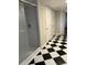 Bathroom with shower, checkerboard floor, and additional rooms at 4765 S Constellation Dr, North Charleston, SC 29418