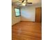 Bright bedroom with hardwood floors and a ceiling fan at 4765 S Constellation Dr, North Charleston, SC 29418
