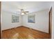 Spacious bedroom with hardwood floors and two windows at 4765 S Constellation Dr, North Charleston, SC 29418