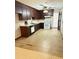 Kitchen with dark wood cabinets and a tile floor at 4765 S Constellation Dr, North Charleston, SC 29418