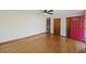 Living room featuring hardwood floors and red door at 4765 S Constellation Dr, North Charleston, SC 29418
