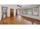Living room with hardwood floors, red door, and window at 4765 S Constellation Dr, North Charleston, SC 29418