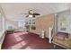 Sunroom with brick walls, carpet, and access to the backyard at 4765 S Constellation Dr, North Charleston, SC 29418