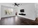 Bright living room featuring hardwood floors and access to balcony at 500 Bucksley Ln # 205, Charleston, SC 29492