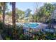 Community pool with lounge chairs and surrounding landscaping at 500 Bucksley Ln # 205, Charleston, SC 29492