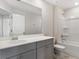 Modern bathroom with a bathtub and gray vanity at 558 Richfield Way, Summerville, SC 29486