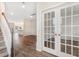 Bright entryway with hardwood floors, staircase, and French doors at 558 Richfield Way, Summerville, SC 29486