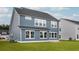 Two-story house with blue siding and a large backyard at 558 Richfield Way, Summerville, SC 29486