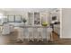 Open concept kitchen featuring granite countertops, gray cabinets, and a breakfast bar at 558 Richfield Way, Summerville, SC 29486