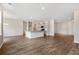 Modern kitchen with granite island, stainless steel appliances, and hardwood floors at 558 Richfield Way, Summerville, SC 29486