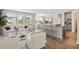 Open concept kitchen with island, stainless steel appliances, and hardwood floors at 558 Richfield Way, Summerville, SC 29486