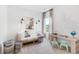 Bright bedroom with a daybed, desk, and coastal decor at 563 Richfield Way, Summerville, SC 29486