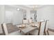 Formal dining room with chandelier and white chairs at 563 Richfield Way, Summerville, SC 29486