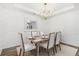Formal dining room with chandelier and white chairs at 563 Richfield Way, Summerville, SC 29486
