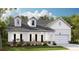 Two-story house with white siding, gray roof, stone accents, and a two-car garage at 563 Richfield Way, Summerville, SC 29486