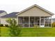 Home features a screened porch and well-manicured lawn at 563 Richfield Way, Summerville, SC 29486