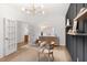 Bright home office with white walls, wood flooring, and French doors at 563 Richfield Way, Summerville, SC 29486