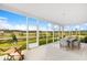 Enjoy outdoor dining on this spacious screened porch overlooking a lush backyard at 563 Richfield Way, Summerville, SC 29486