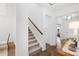 Modern staircase with light beige carpet runner and wooden handrail at 563 Richfield Way, Summerville, SC 29486