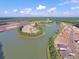 Aerial view of a community lake and surrounding development at 566 Richfield Way, Summerville, SC 29486