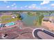 Aerial view of a community lake, homes, and under-construction areas at 566 Richfield Way, Summerville, SC 29486