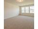 Spacious bedroom with neutral carpet and large windows at 566 Richfield Way, Summerville, SC 29486