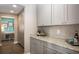 Walk-in pantry with gray cabinets and granite countertops at 566 Richfield Way, Summerville, SC 29486