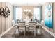 Bright dining room featuring a white table, chairs, and elegant chandelier at 566 Richfield Way, Summerville, SC 29486