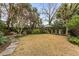 Landscaped backyard with a stone patio and lush greenery at 66 Warren St # Entire Property, Charleston, SC 29403