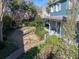 Landscaped backyard with a curved walkway and lush greenery at 66 Warren St # Entire Property, Charleston, SC 29403