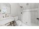 Modern bathroom with marble vanity and walk-in shower at 66 Warren St # Entire Property, Charleston, SC 29403