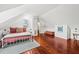 Bright bedroom with hardwood floors and a white metal bed frame at 66 Warren St # Entire Property, Charleston, SC 29403