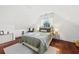 Upstairs bedroom with hardwood floors and a cozy sitting area at 66 Warren St # Entire Property, Charleston, SC 29403