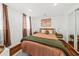 Second bedroom with a comfy bed and neutral decor at 66 Warren St # Entire Property, Charleston, SC 29403