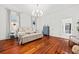 Bright bedroom with hardwood floors and access to a walk-in closet at 66 Warren St # Entire Property, Charleston, SC 29403
