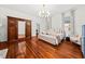 Bright bedroom with hardwood floors and a comfortable bed at 66 Warren St # Entire Property, Charleston, SC 29403