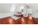 Cozy bedroom with hardwood floors and a view from the window at 66 Warren St # Entire Property, Charleston, SC 29403