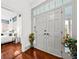 Bright entryway with hardwood floors, showcasing a glimpse of a bedroom and access to the outdoors at 66 Warren St # Entire Property, Charleston, SC 29403