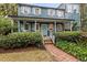 Charming two-story home with a covered porch and landscaped yard at 66 Warren St # Entire Property, Charleston, SC 29403