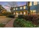 Charming two-story home with a covered porch and landscaped yard at 66 Warren St # Entire Property, Charleston, SC 29403