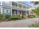 Beautiful two-story home with a wraparound porch and manicured landscaping at 66 Warren St # Entire Property, Charleston, SC 29403