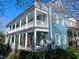 Charming two-story home with wrap-around porch and white columns at 66 Warren St # Entire Property, Charleston, SC 29403