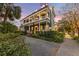 Two-story home with wraparound porch and landscaped yard at 66 Warren St # Entire Property, Charleston, SC 29403