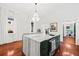 Open kitchen showcasing a large island and stainless steel appliances at 66 Warren St # Entire Property, Charleston, SC 29403