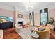Spacious living room with a fireplace and hardwood floors at 66 Warren St # Entire Property, Charleston, SC 29403
