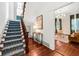 Grand staircase leading to upper level, with view of living room at 66 Warren St # Entire Property, Charleston, SC 29403
