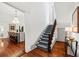 Elegant staircase with dark wood railings and patterned runner at 66 Warren St # Entire Property, Charleston, SC 29403
