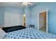 Blue bedroom with two beds, ceiling fan, and access to bathroom at 7963 Shadow Oak Dr, North Charleston, SC 29406